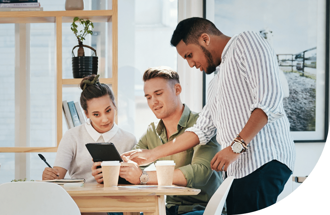 3 people looking at tablet